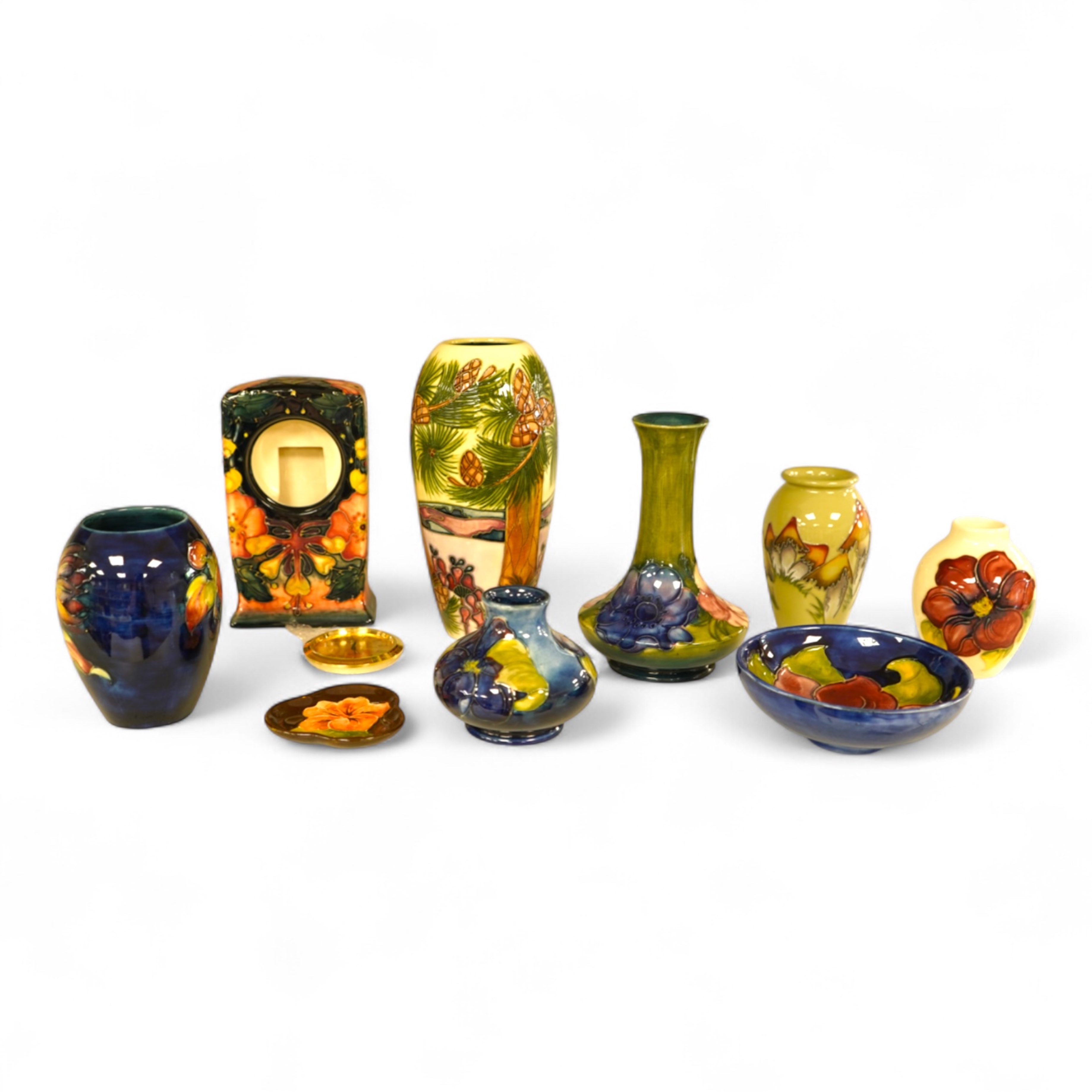 A collection of nine modern Moorcroft pieces including a Furzy Hill vase and a Toadstool vase, tallest 19cm